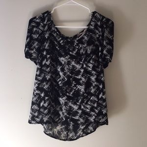 Black and white patterned blouse with zipper back
